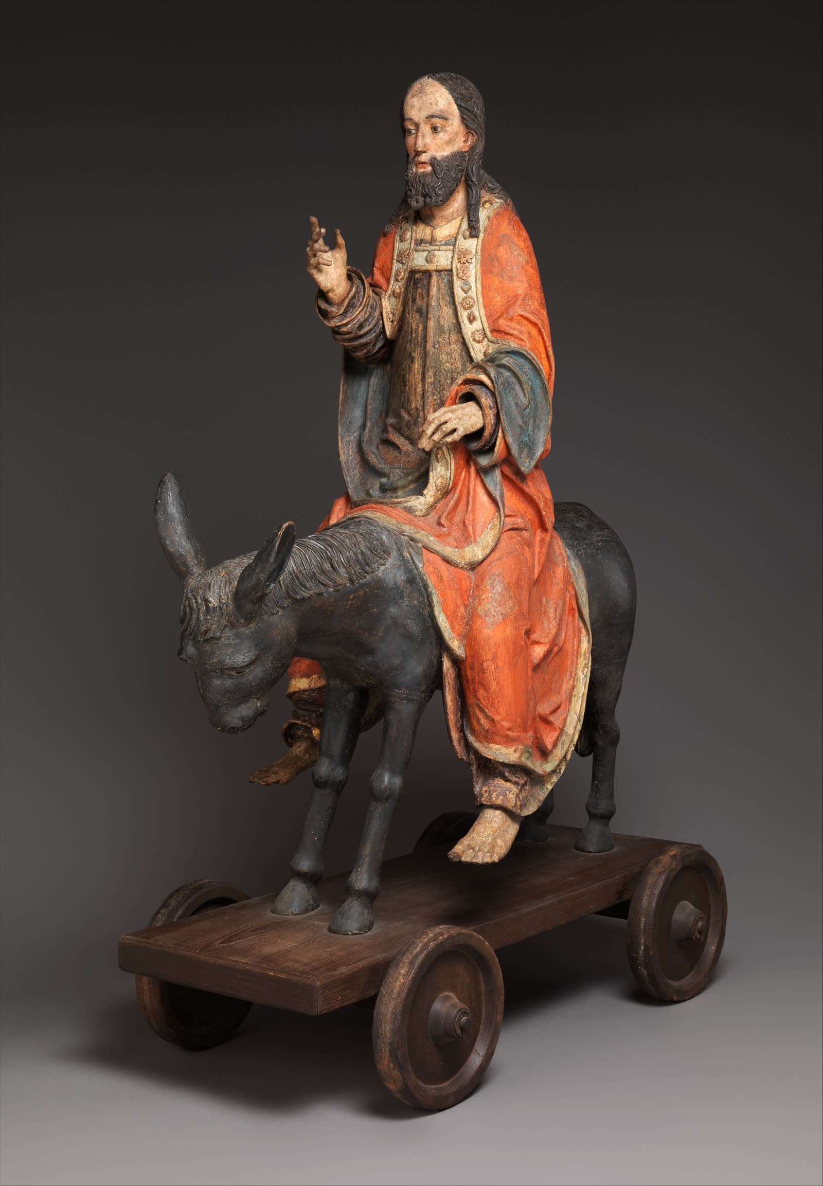 A painted limewood Palmesel sculpture the Metropolitan Museum of Art calls German, 15th century.