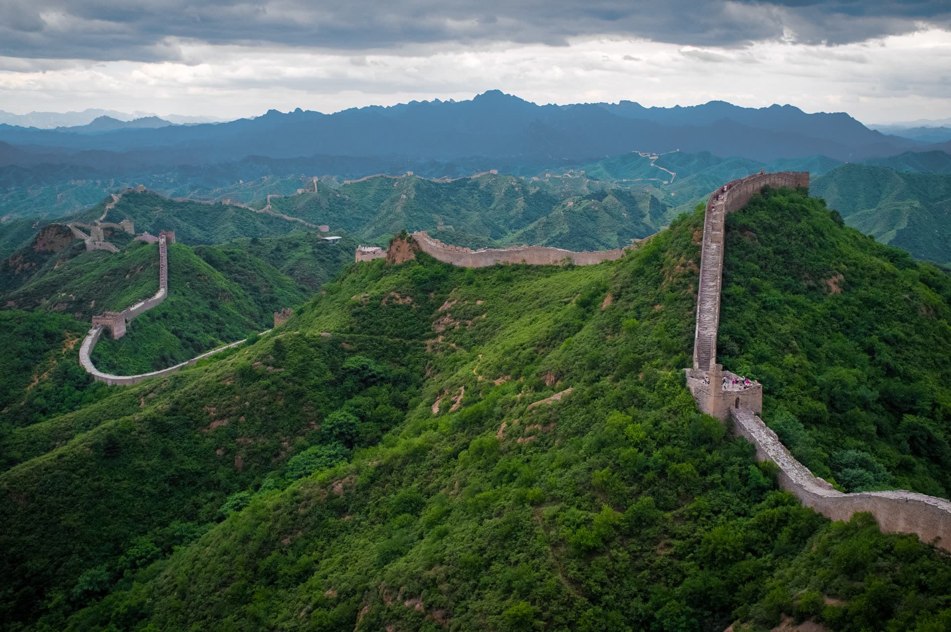 The Great Wall running along forested ridges at Jinshanling.