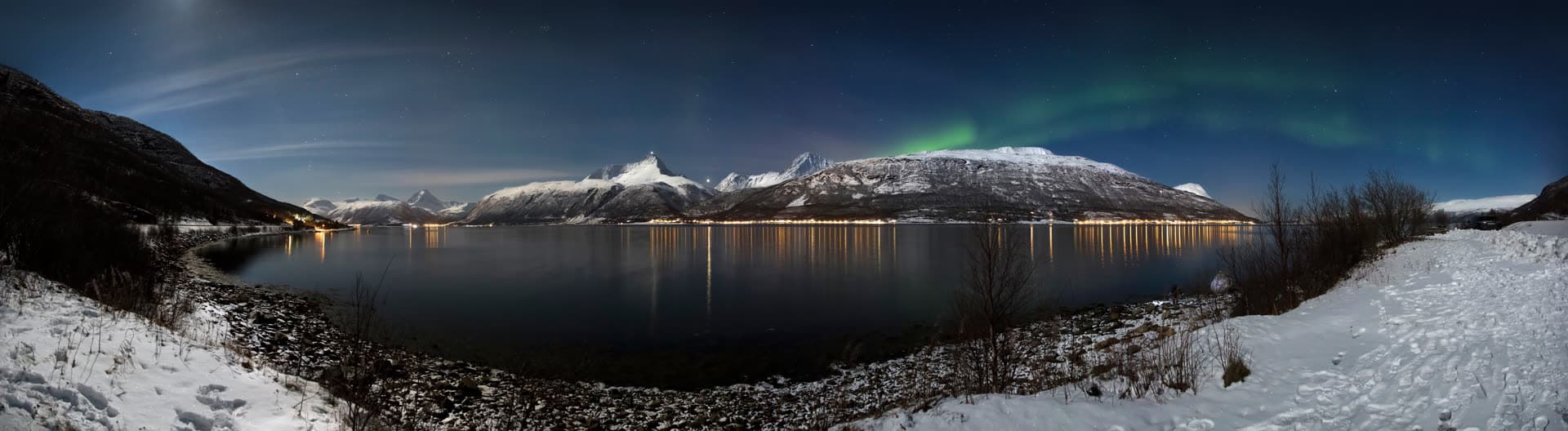 Aurora over Storfjorden and the Lyngen Alps in moonlight, March 2012.