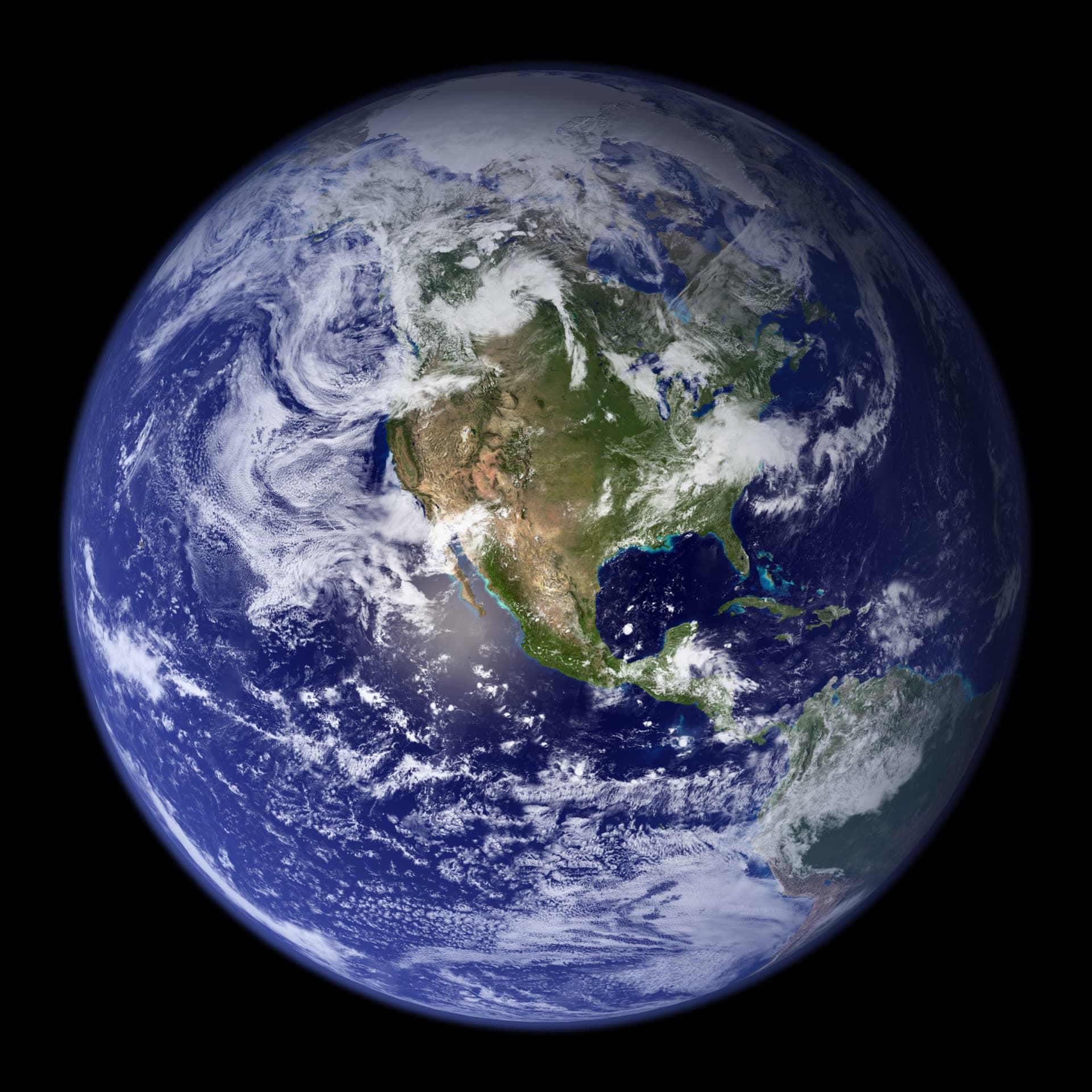 A NASA Blue Marble view of the western hemisphere, with the Americas under cloud.