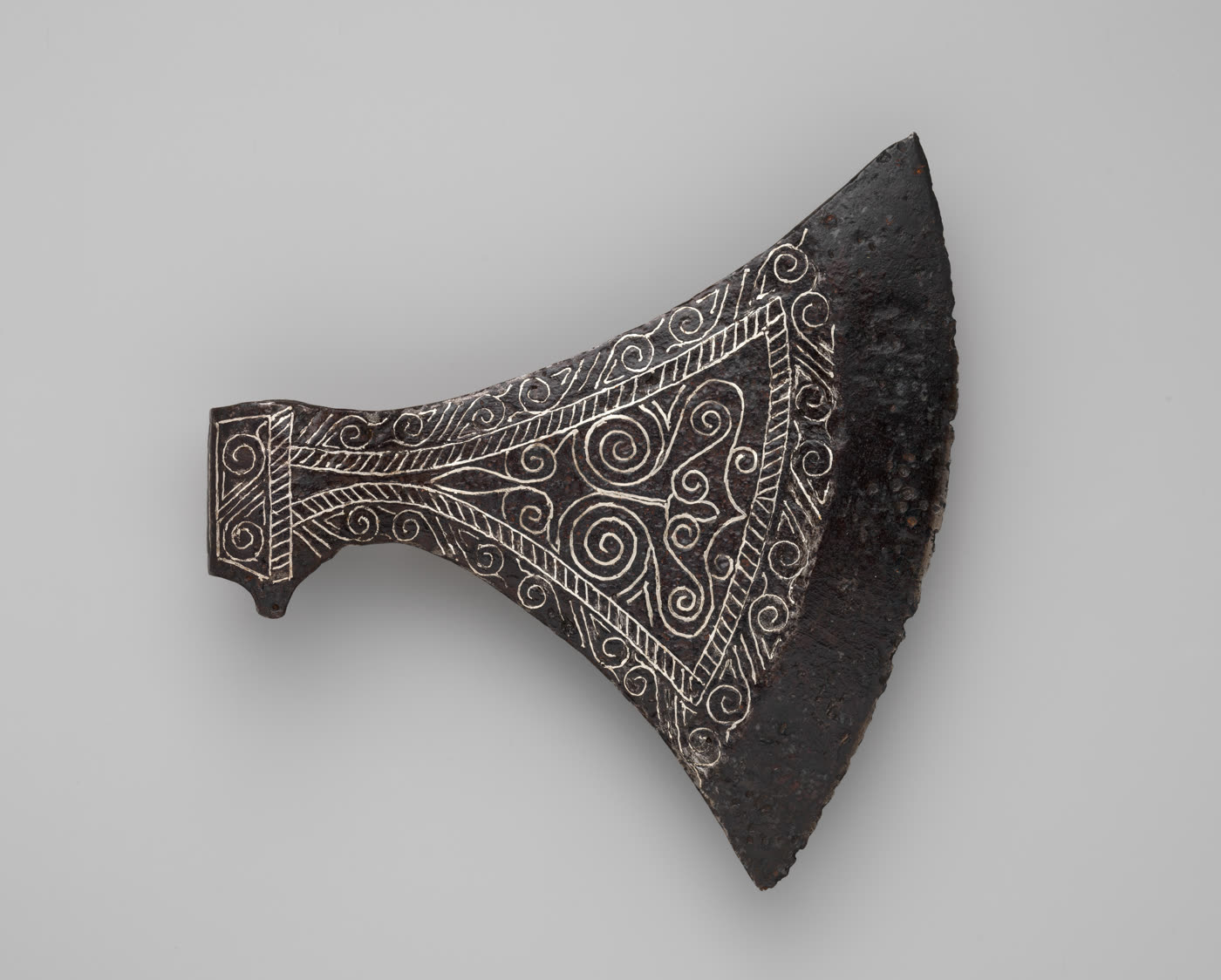 An iron axe head in the Metropolitan Museum of Art.
